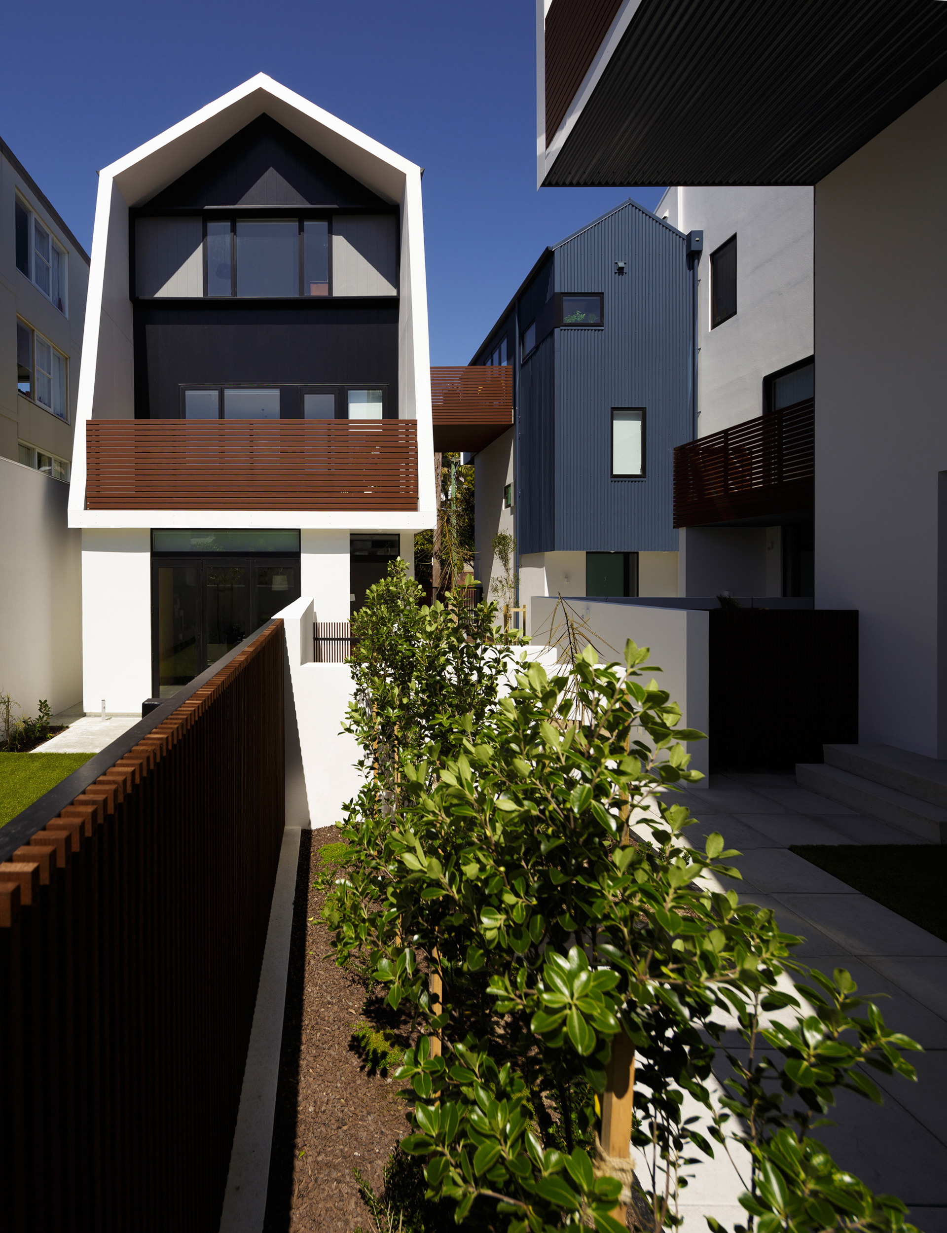 The apartments wrap around an interior courtyard with planting by O2 Landscapes. 
