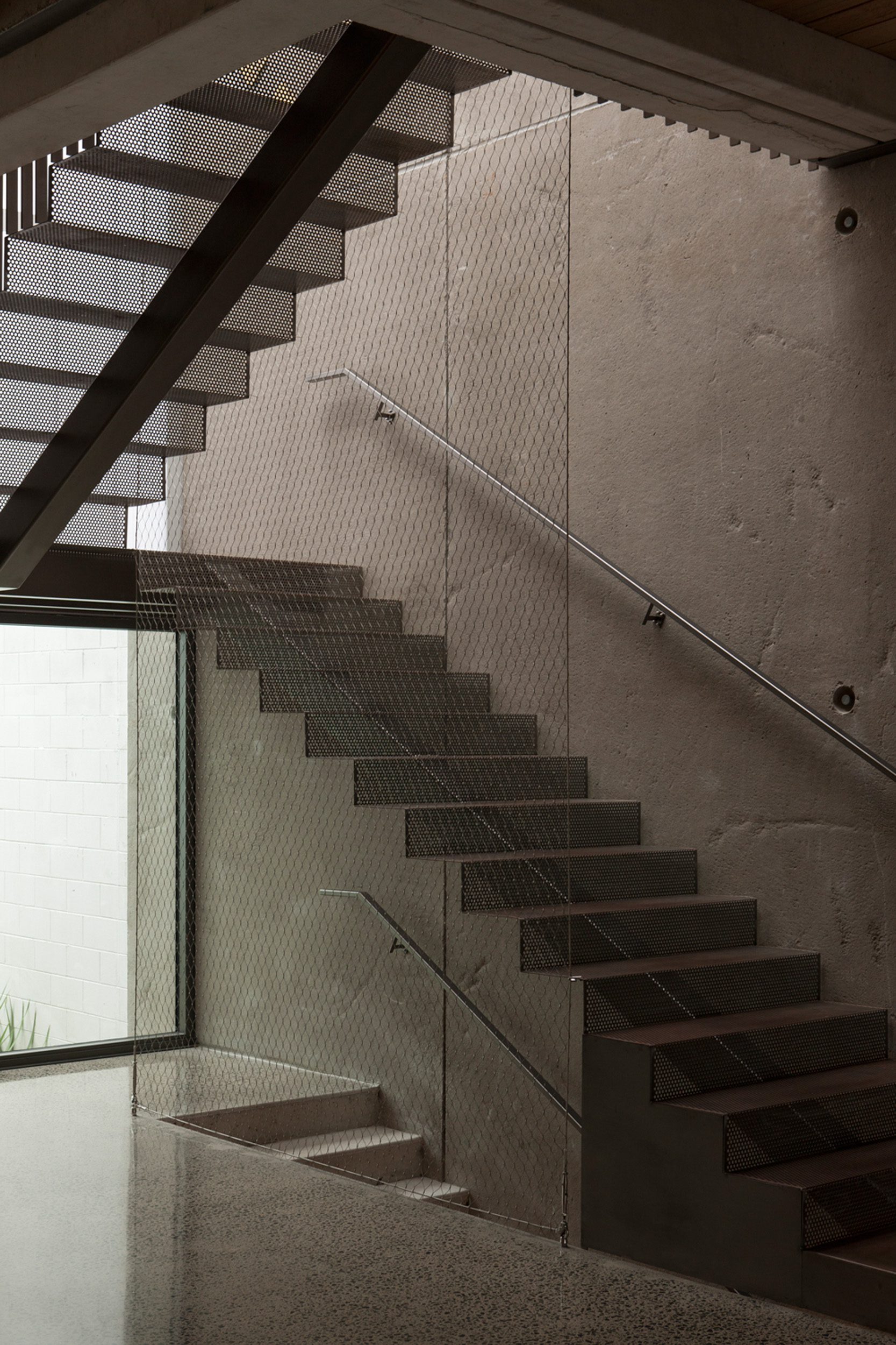 The staircase is made from perforated steel plate. 