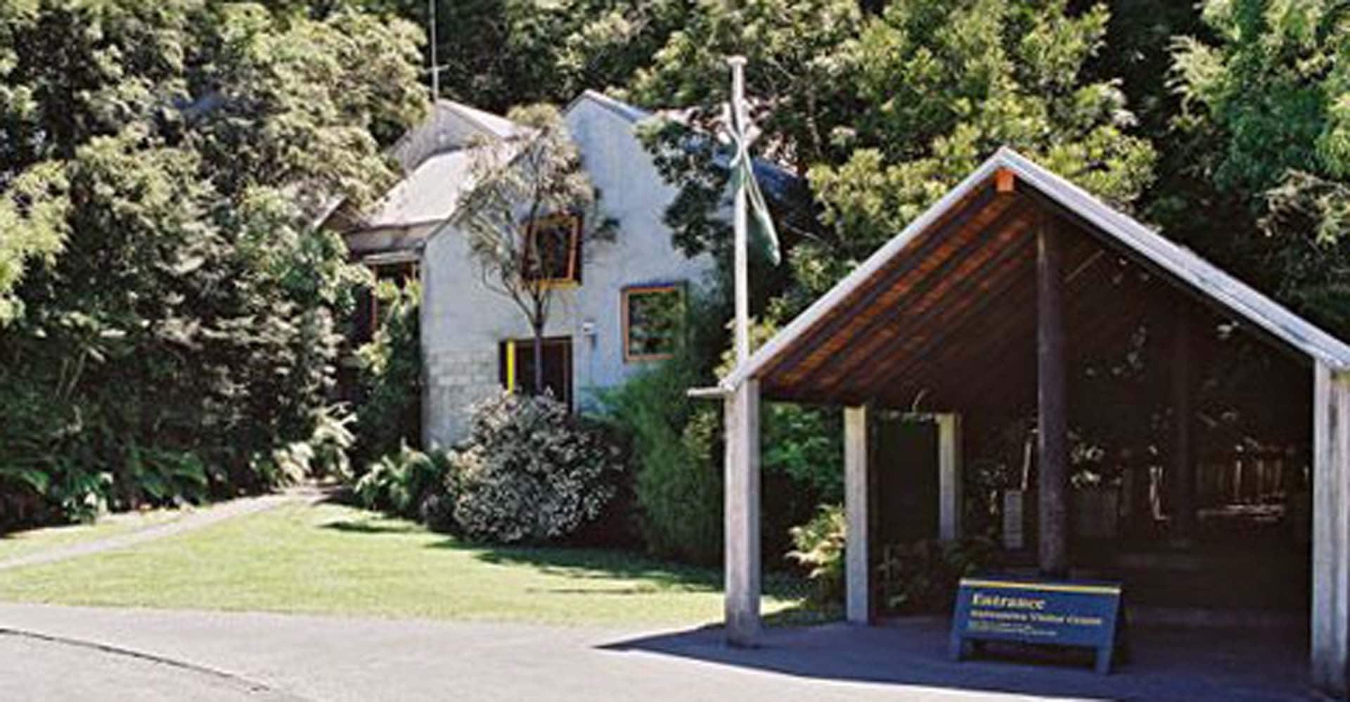 The building is nestled into the forest near the shore of Lake Waikaremoana. 