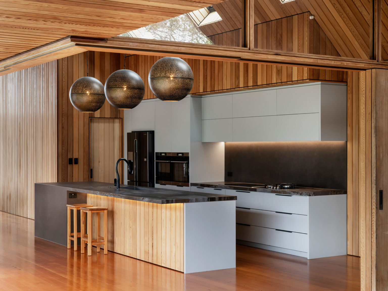 An overtly modern addition to an historic villa A kitchen of timber