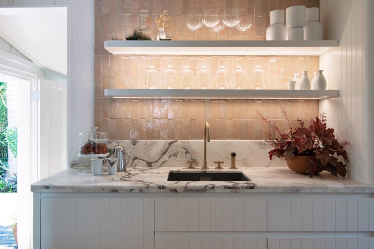 5. Little White Cottage Kitchen - Sink cabinetry details