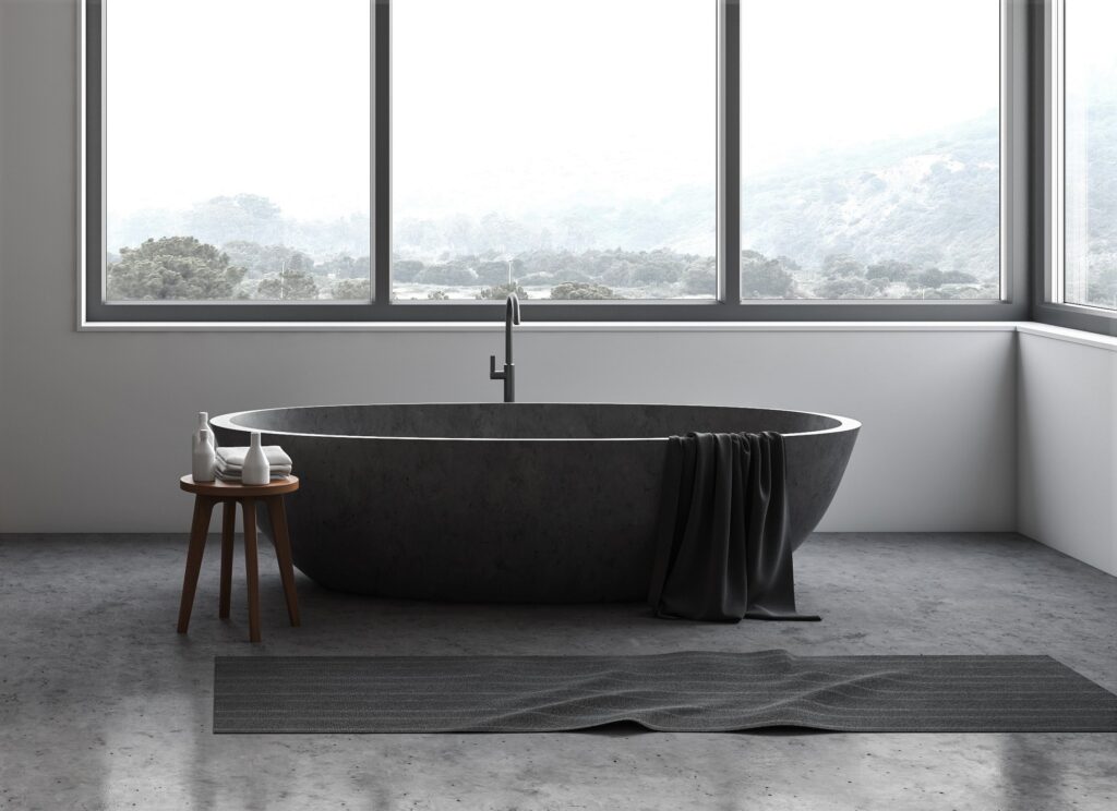 Interior of spacious hotel bathroom with white and wooden walls, concrete floor, comfortable stone bathtub standing under window with blurry mountain scenery and double sink. 3d rendering